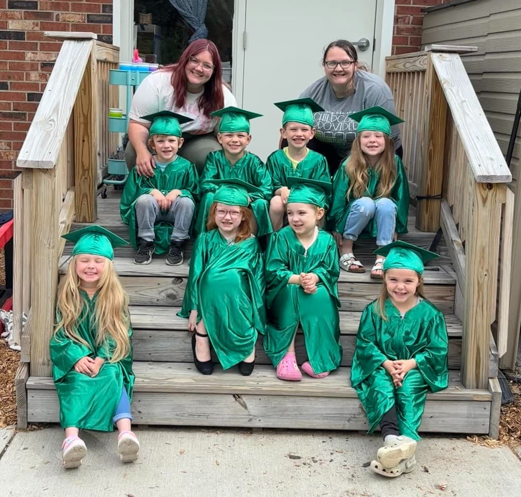 Little Acorns Learning Center graduation day — Great Oaks kids in green caps and gowns