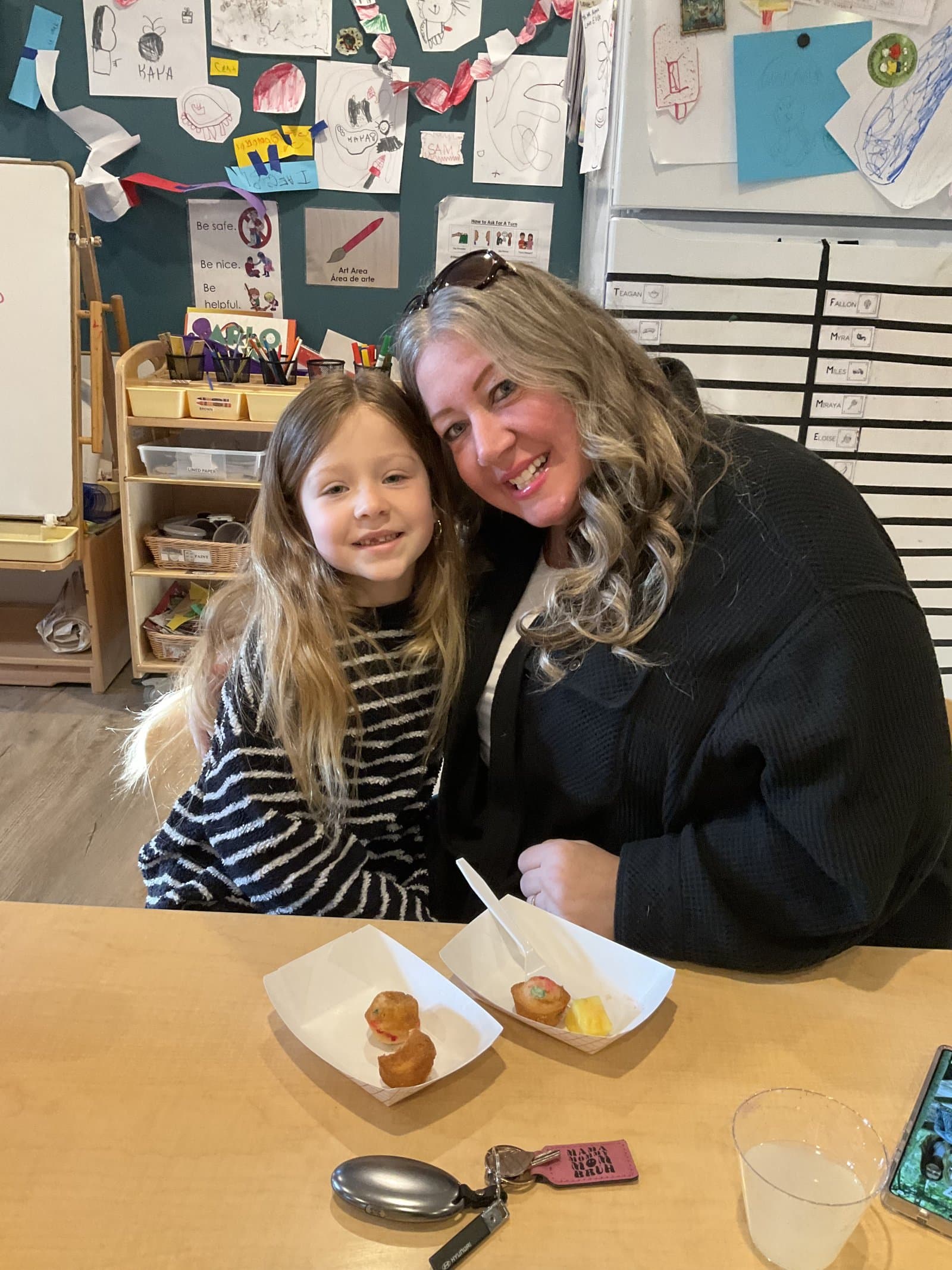 Mother and daughter sharing a treat at a Little Acorns parent event