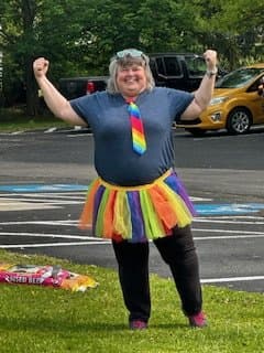 Little Acorns Chief Playmaker celebrating in a colorful tutu — the glue holding the center together